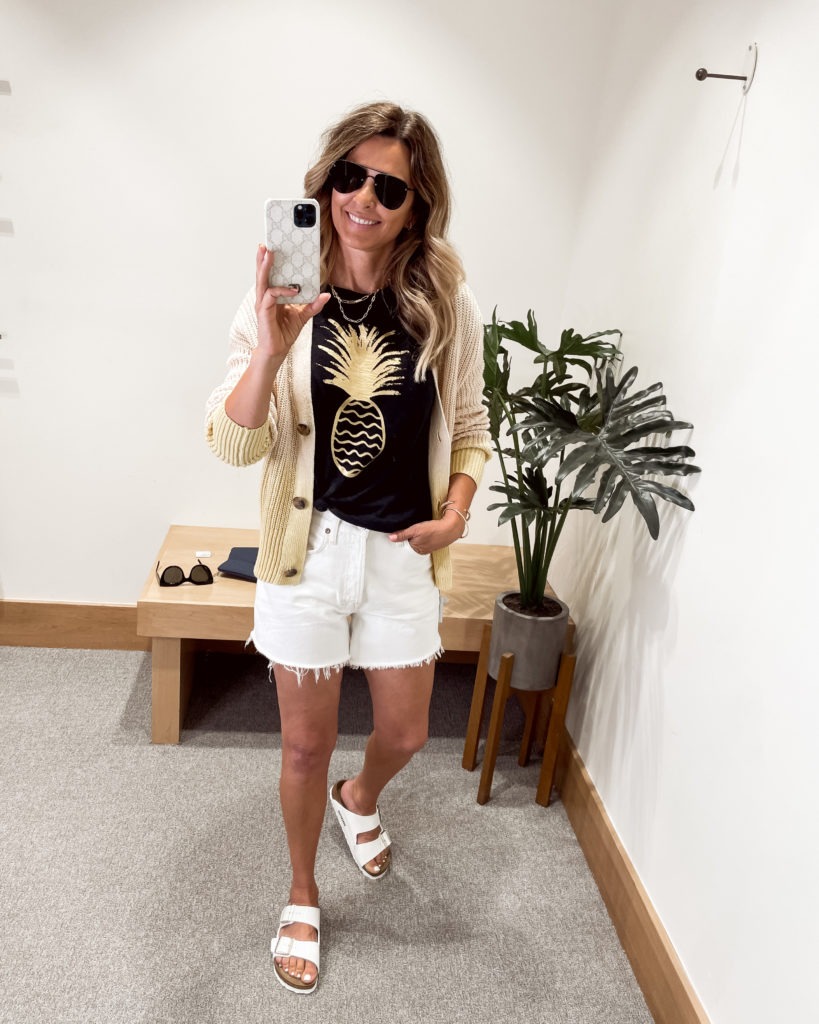 Black pineapple tee paired with white denim shorts by Agolde from Evereve